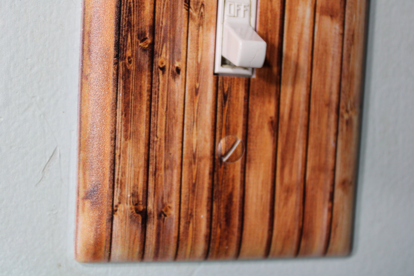 knotty pine pallet wood barnwood with warn painted paint chips light switch cover plate farmhouse decor rustic cedar
