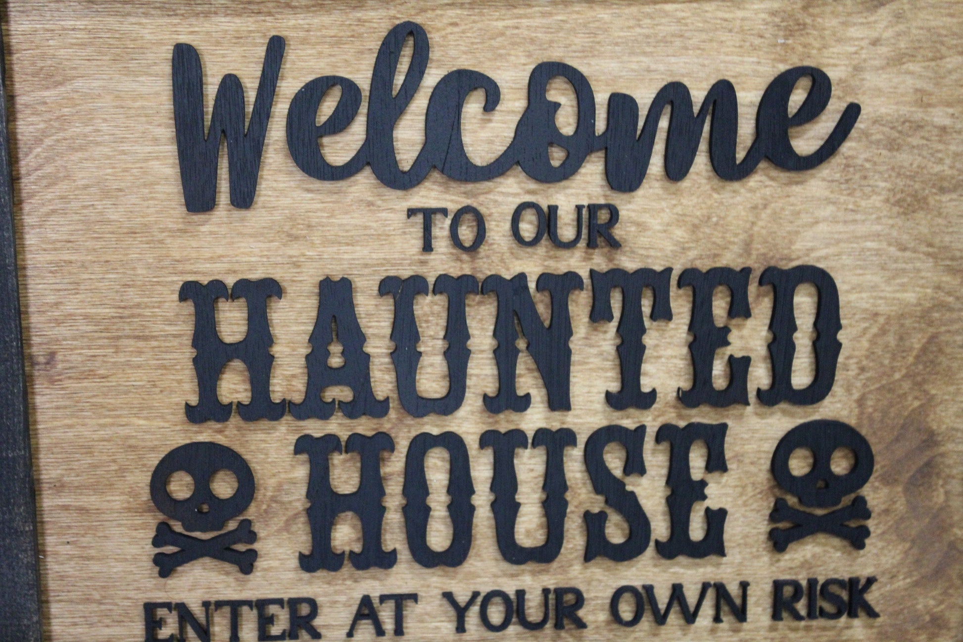 Welcome to Our Haunted House Sign Skull Crossbones Enter at Your Own Risk Halloween Scary 3D Raised Text Country Farmhouse Cabin Wood Decor