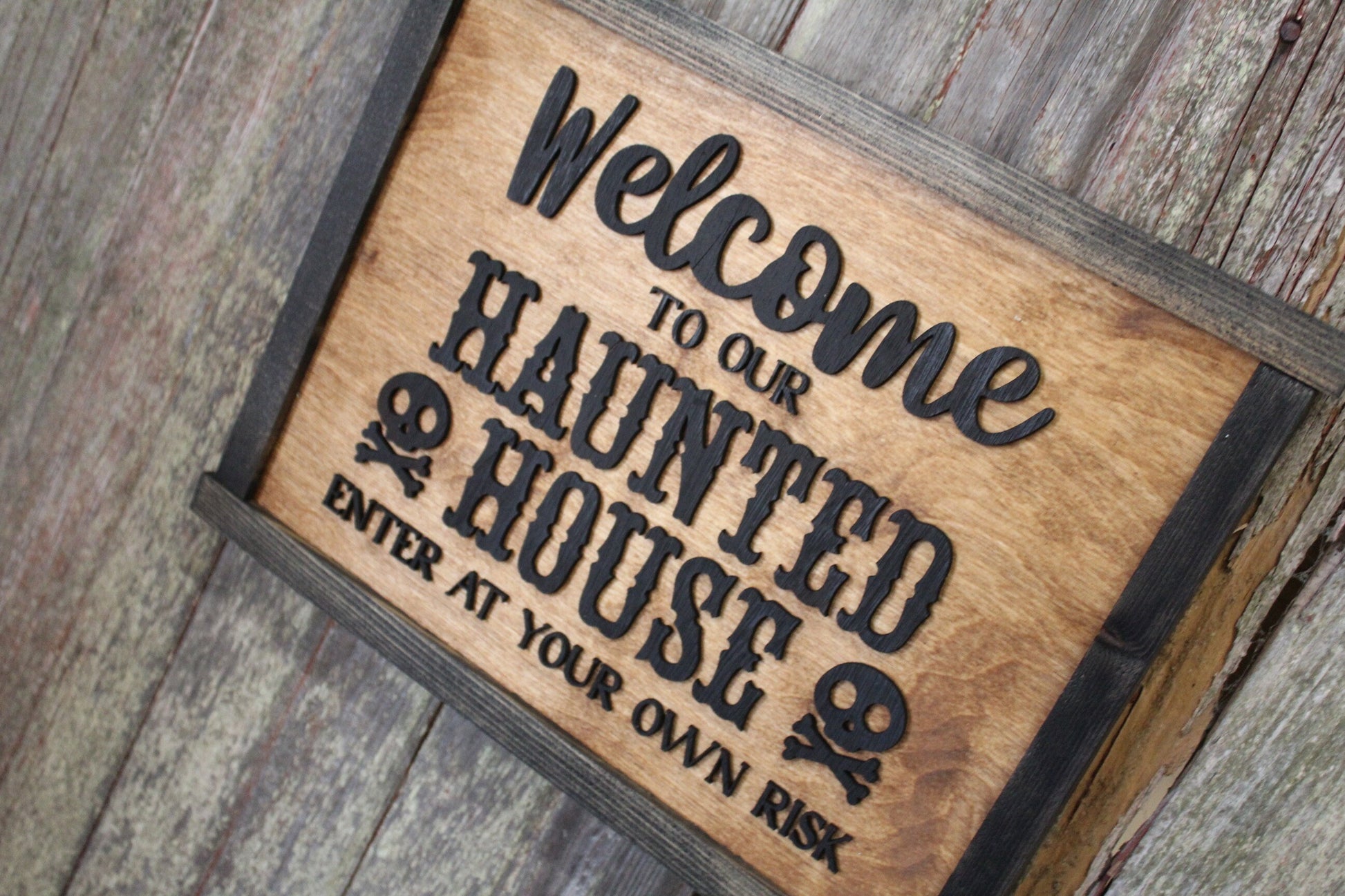 Welcome to Our Haunted House Sign Skull Crossbones Enter at Your Own Risk Halloween Scary 3D Raised Text Country Farmhouse Cabin Wood Decor