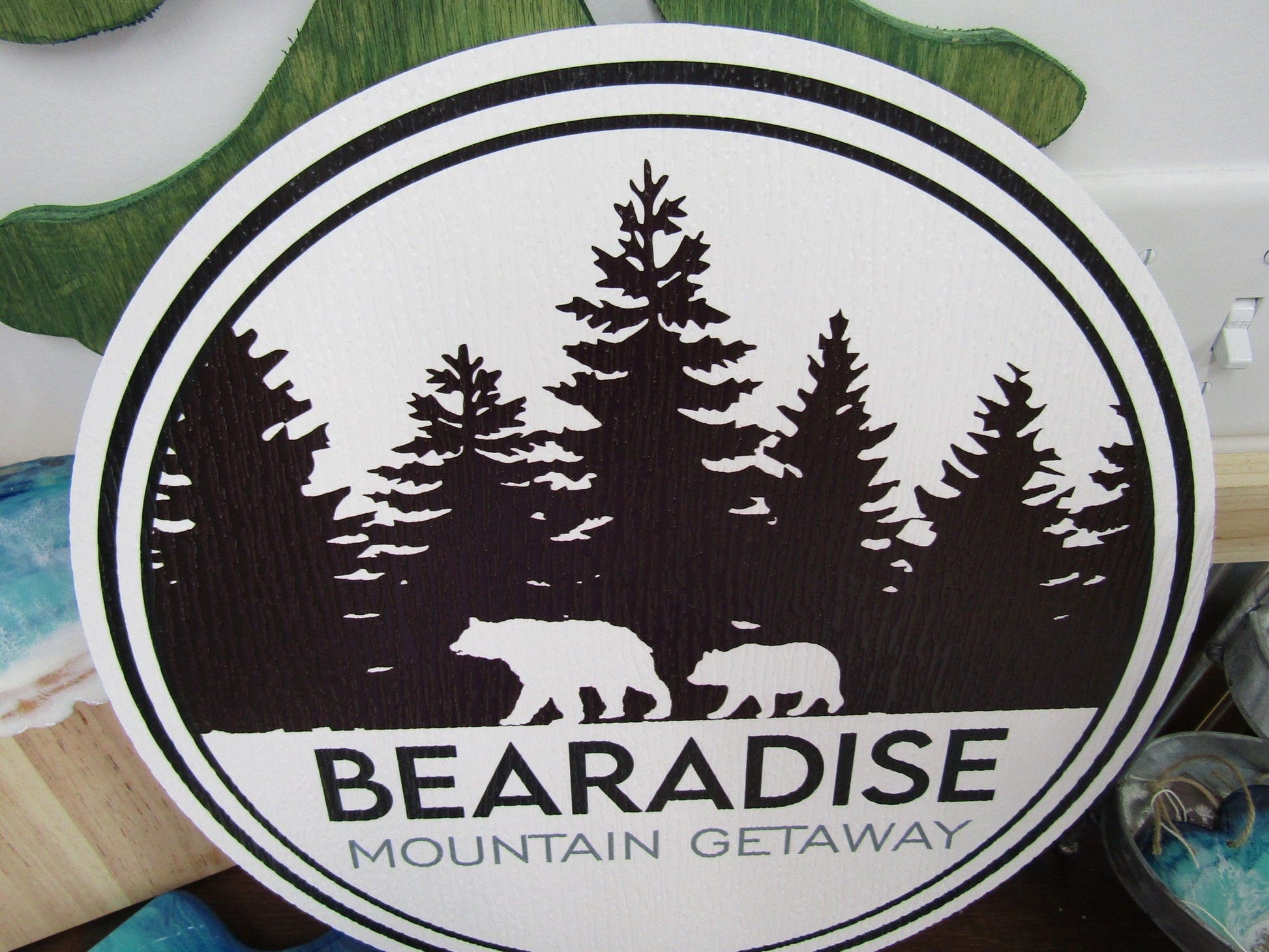 PVC sign for Bear's Paradise Mountain Getaway, showcasing custom cabin pine trees wilderness bears textured PVC, weather fade resistant, waterproof UV printed color logo business commercial signage.