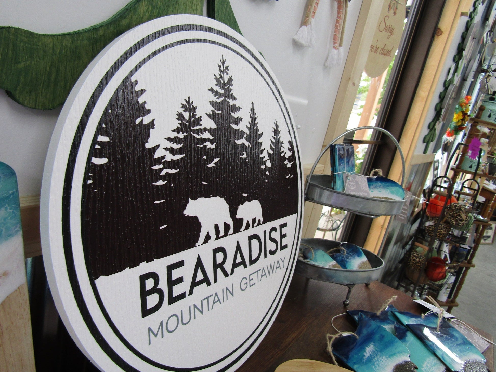 PVC sign for Bear's Paradise Mountain Getaway, showcasing custom cabin pine trees wilderness bears textured PVC, weather fade resistant, waterproof UV printed color logo business commercial signage.