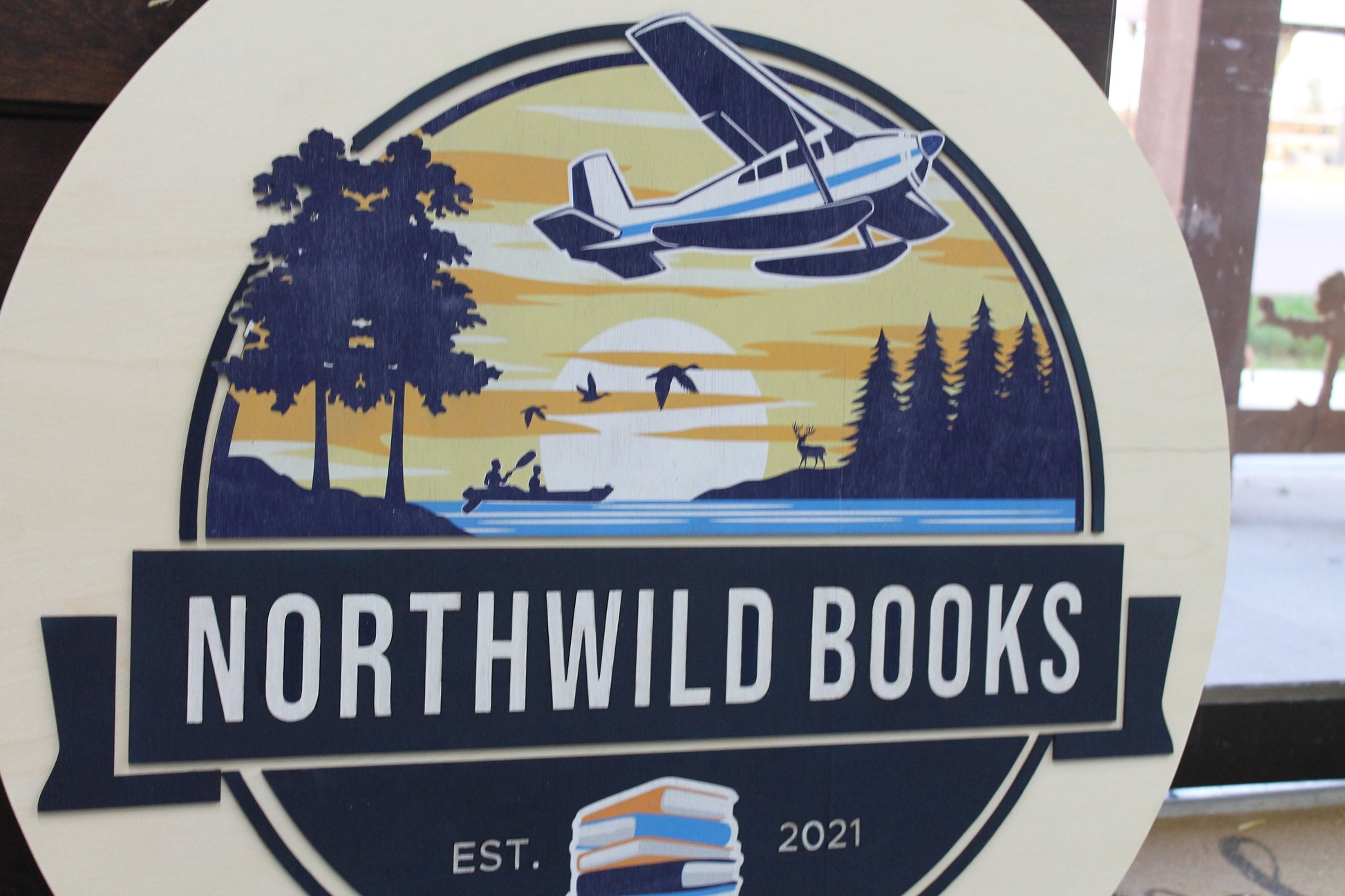 Book Store Small Business Logo Custom Round Sign Printed In Color Raised Lettering Sunset Airplane Commerical Store Front Signage