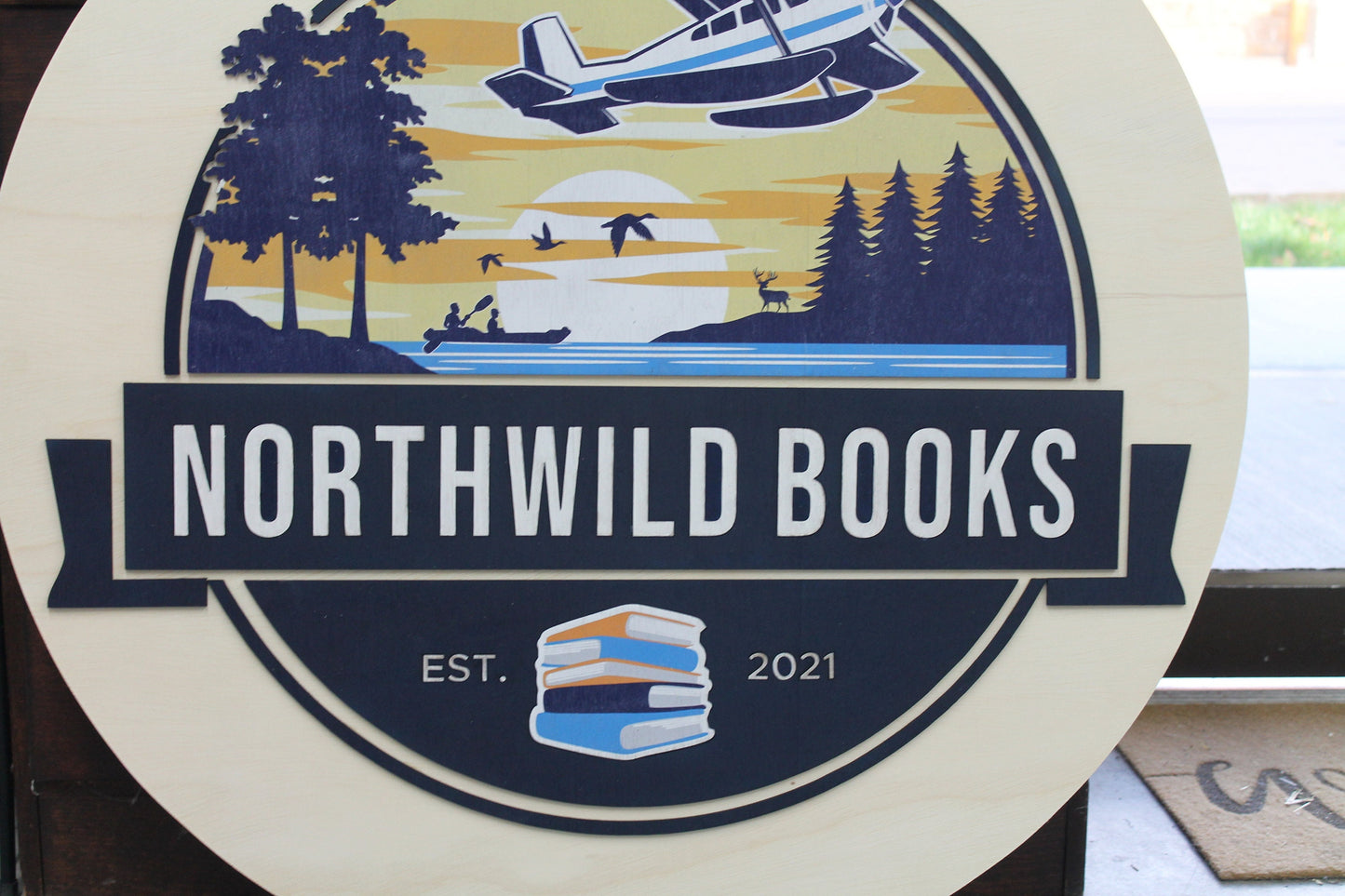 Book Store Small Business Logo Custom Round Sign Printed In Color Raised Lettering Sunset Airplane Commerical Store Front Signage