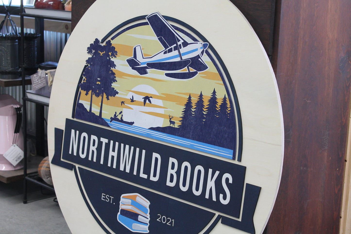 Book Store Small Business Logo Custom Round Sign Printed In Color Raised Lettering Sunset Airplane Commerical Store Front Signage
