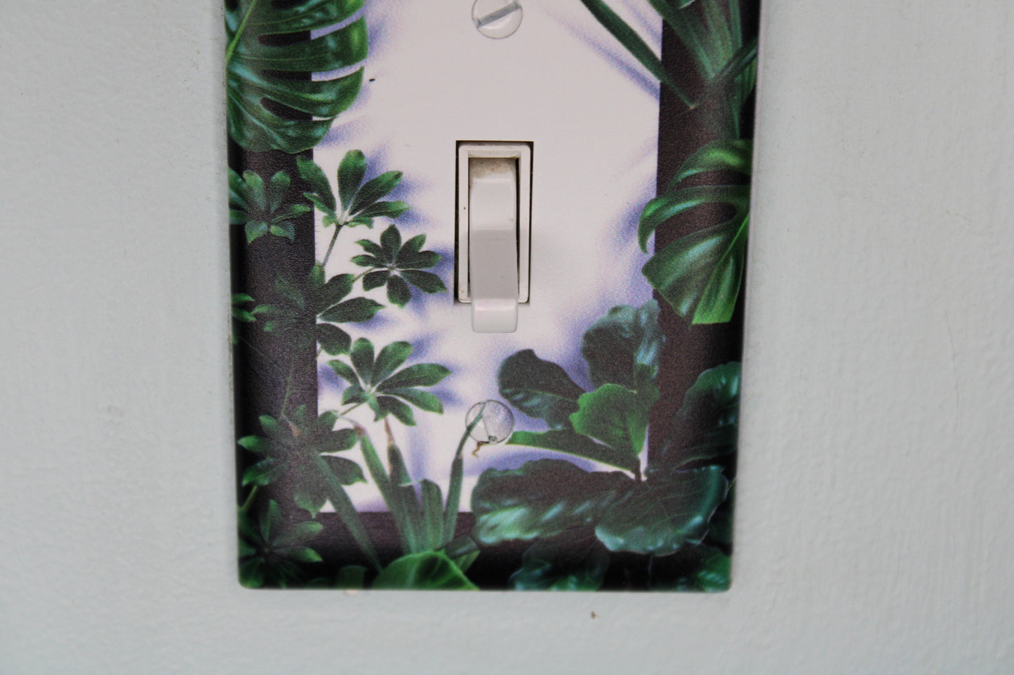 deep green forest jungle houseplants palm monstera leaves plants light switch plate cover printed durable green decor unique custom piece