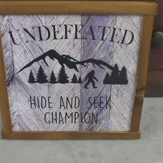 Printed Bigfoot Sign – Rustic Wood Framed Wall Art – Funny Sasquatch Cabin Decor – Undefeated Hide and Seek Champion Printed Wooden Sign